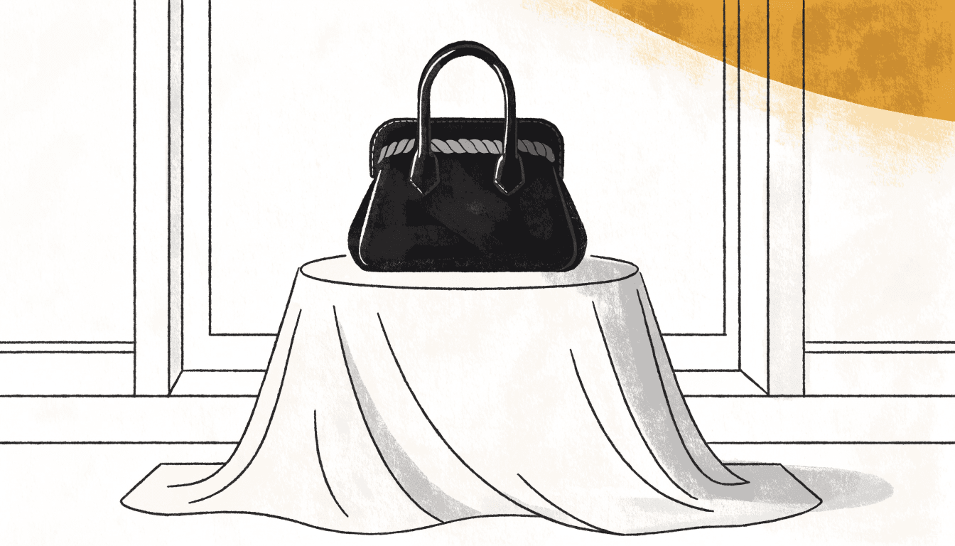 Flat editorial illustration of a structured black handbag with a rope-pattern clasp on a draped pedestal.